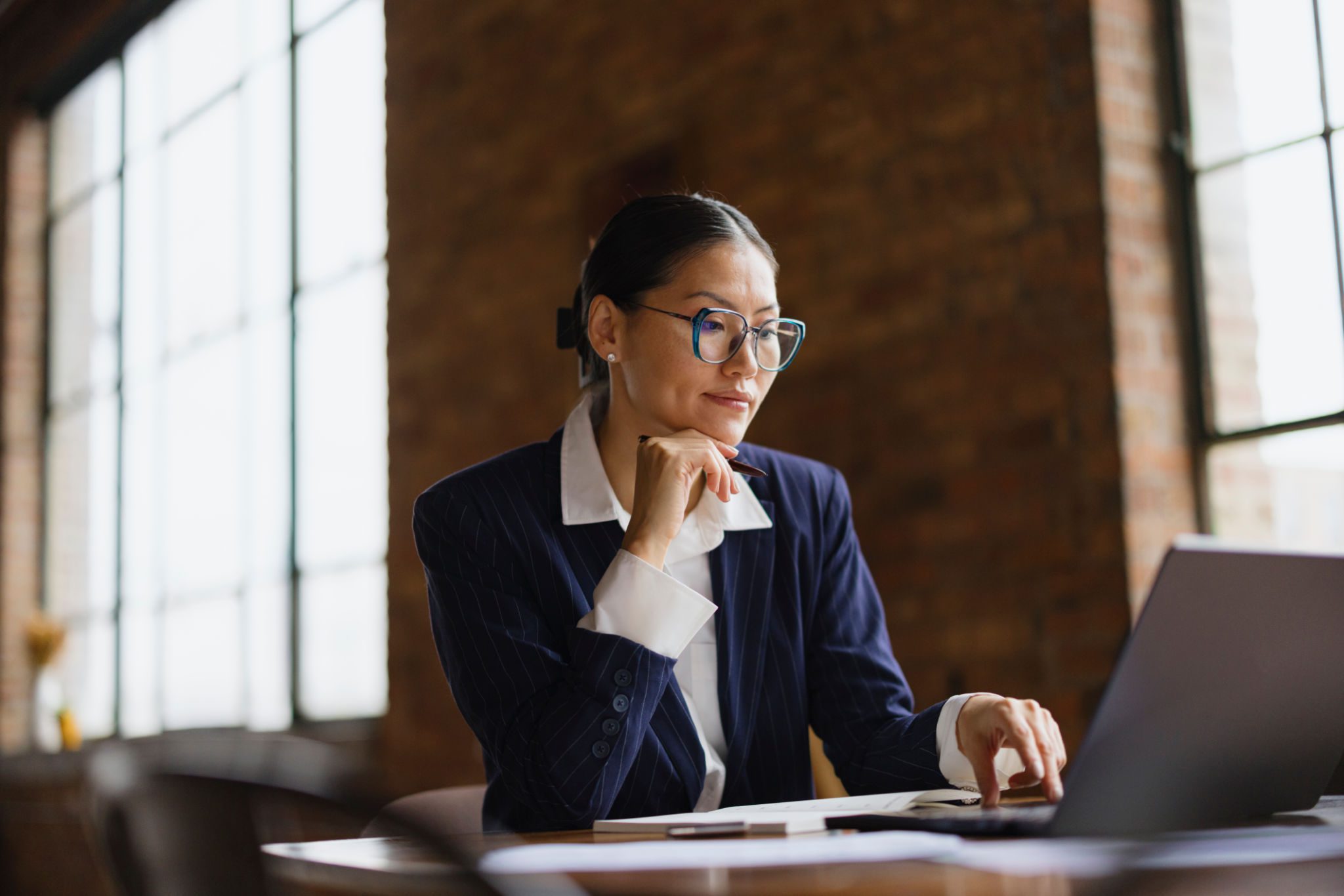 Professional woman focused on computer screen